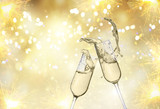 Fototapeta Sypialnia - Two festive champagne glasses on golden bokeh background with lights and fireworks