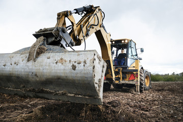 Man in a backhoe loader