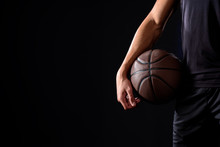 Cropped Shot Of Basketball Player With Ball Isolated On Black