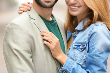 Wall Mural - Young happy couple together outdoors on engagement day