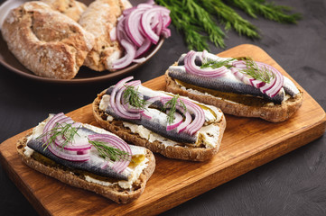 Herring sandwiches with pickled cucumber.