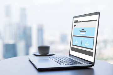 laptop with web page interface design on screen