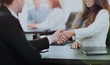 © ASDF - Business people shaking hands, finishing up a meeting