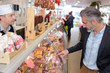 Man choosing from delicatessen counter