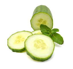 Cucumber and slices isolated over white background.