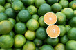 Fresh Juicy Green Mandarin Heap on Market Stall