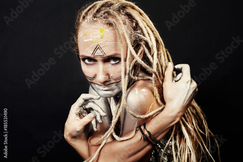 Young Woman With Creative Color Makeup And Dread Locks Hair