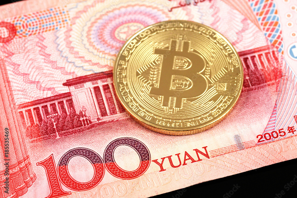 A close up image of a 100 yuan note with a bitcoin