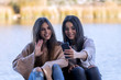 © fresnel6 - Two friends, use your mobile phone together