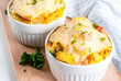 Homemade italian bread casserole strata with cheese, egg and ham, white background copy space