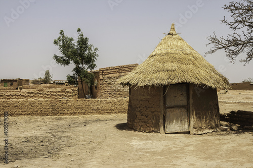 Traditional hut in a village of Burkina Faso (West Africa) Poster Mural XXL