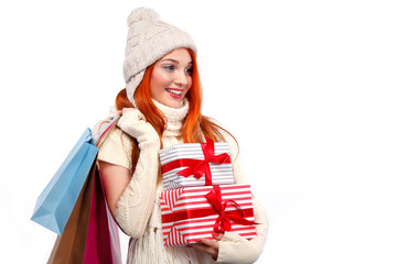 Wall Mural - Christmas and New Year holidays. Happy woman holding gift boxes and bags after shopping on white background in black friday. Copy space.