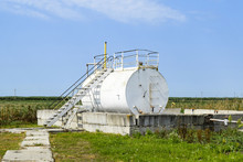 Reservoir For Sludge Of Oil Emulsion. Equipment At The Oil Field