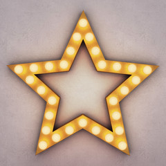 Wall Mural - Golden retro star with glowing light bulbs on concrete background. 3D rendering