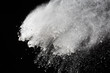 White powder. Grainy abstract texture on black background.