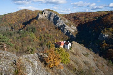 Wall Mural - Historic monastery and church in the Svaty Jan pod Skalou, Central Bohemia, Czech republic