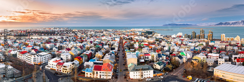Aerial panorama of downtown Reykjavik at sunset with colorful houses and comm...