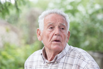 Wall Mural - Depressed old man in park