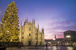 Milan, Italy: Duomo square in december with the christmas tree in front of Milan cathedral, night view.