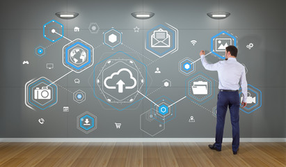 Poster - Businessman using cloud interface on a wall 3D rendering