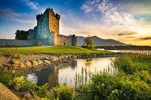 Ancient Old Fortress Ross Castle Ruin With Lake And Grass In Ireland During Golden Hour Nobody
