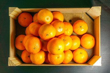 A basket of oranges. sweet fruit for orange juice lots of nutritions and vitamins, especially vitamin C. Citrus species Citrus × sinensis in the family Rutaceae.  Grown in tropical and subtropical.