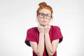 Wall Mural - Happy cheerful young woman wearing red shirt, looking at camera with joyful and charming smile