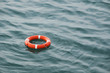 orange lifebuoy on the waves as the concept of salvation