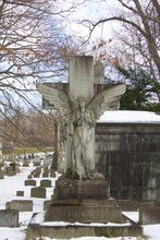 Exterior Daytime Stock Photo Of Marble Angel Atop Headstone In Mt. Hope Cemetery In Rochester New York In Monroe County