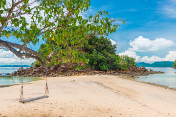 Wall Mural - wooden swing on the sandy beach of Thailand Island