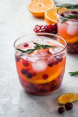 Wall Mural - Winter cranberry citrus pomegranate drink. Selective focus, copy space. 