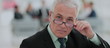 © ASDF - Portrait of mature businessman with  colleagues interacting on b