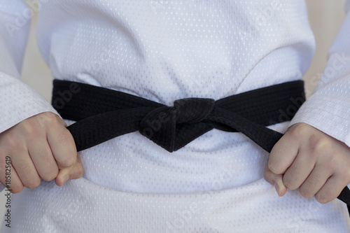Fotografering The taekwondo girl with black belt