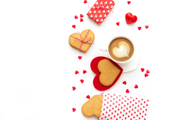 Wall Mural - Festive composition with cookies in shape of heart, gift box and hearts. Valentine's day background isolated in white