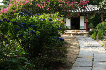 A South Korean traditional architecture in a garden with flowers 2