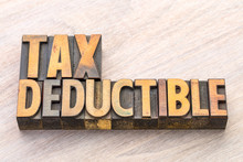 Tax Deductible Word Abstract In Wood Type