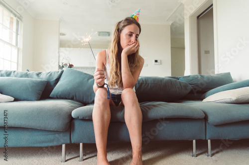 Fotomural Sad Bored Woman at a Party Having No Fun