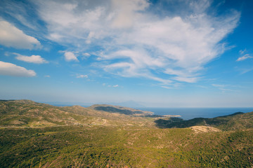 a view of the mountains and the Mediterranean Sea on a sunny summer day. Greece, travel.