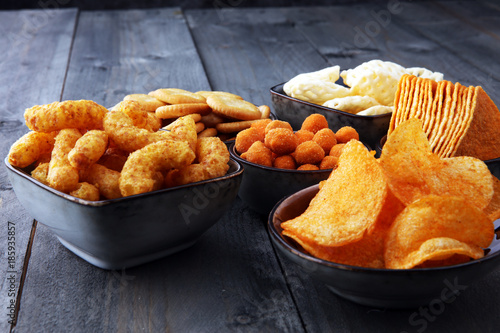 Cuadros en Lienzo Salty snacks. Pretzels, chips, crackers in bowls