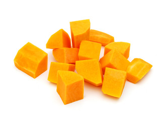 Wall Mural - A group of cut and slice butternut squash chunks on a white background.