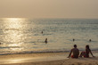 © evolutionnow - scenic beautiful romantic sunset over the sea with people silhouette in standing in water and enjoy the evening orange sun at adaman ocean, Patong Beach Phuket island, Thailand
