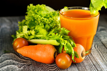 Healthy diet, glass of carrot juice and vegetables