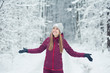 © alipko - Beautiful girl walking in the winter forest
