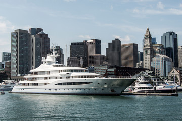 Wall Mural - Yacht and sailing boats on Charles River in front of Boston Skyline in Massachusetts USA on a sunny summer day