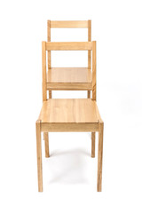 two solid wood chairs isolated the white background.