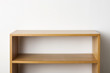 © dohee - empty solid wood shelf isolated the white background.