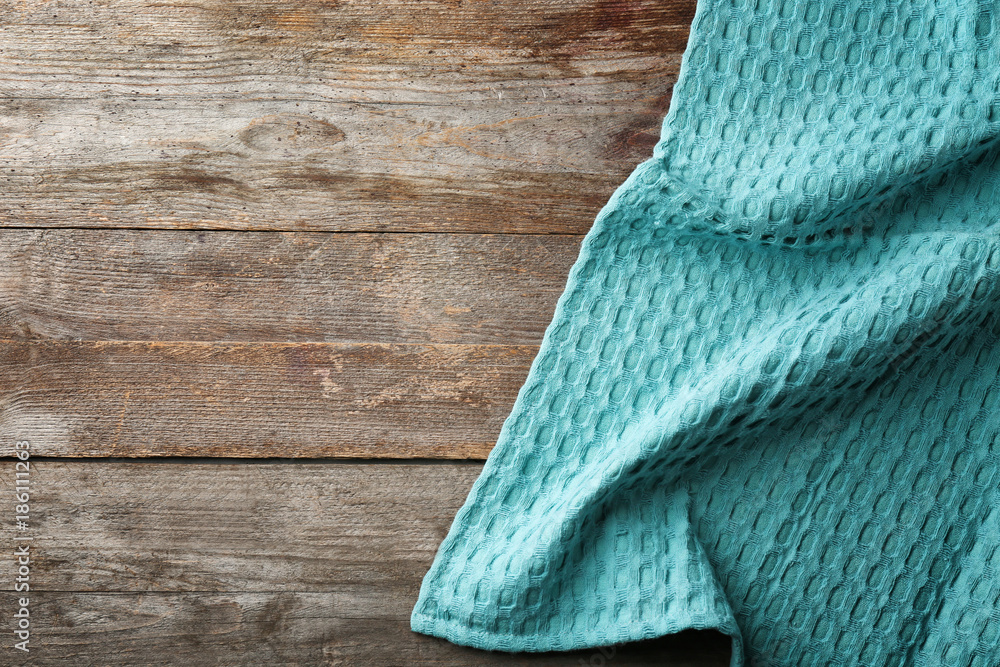 Clean kitchen towel on wooden table