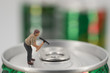© Sebastian - Miniature workman open a can
