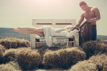 Wall Mural - Couple in love on bench on mountain landscape