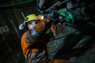 Wall Mural - Miner fixing machine